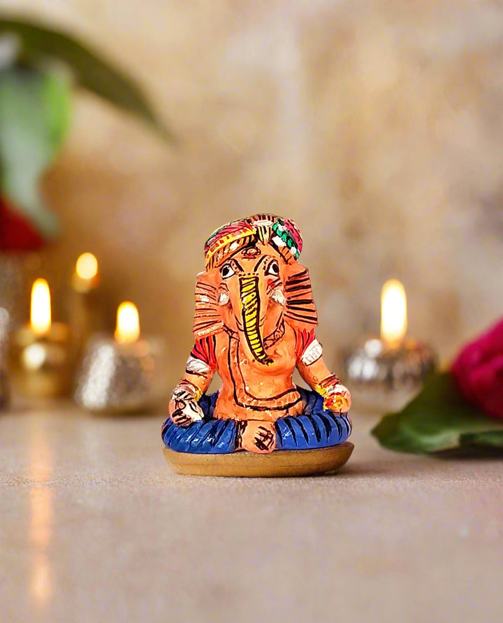 Colorful figurine of a deity on a white background